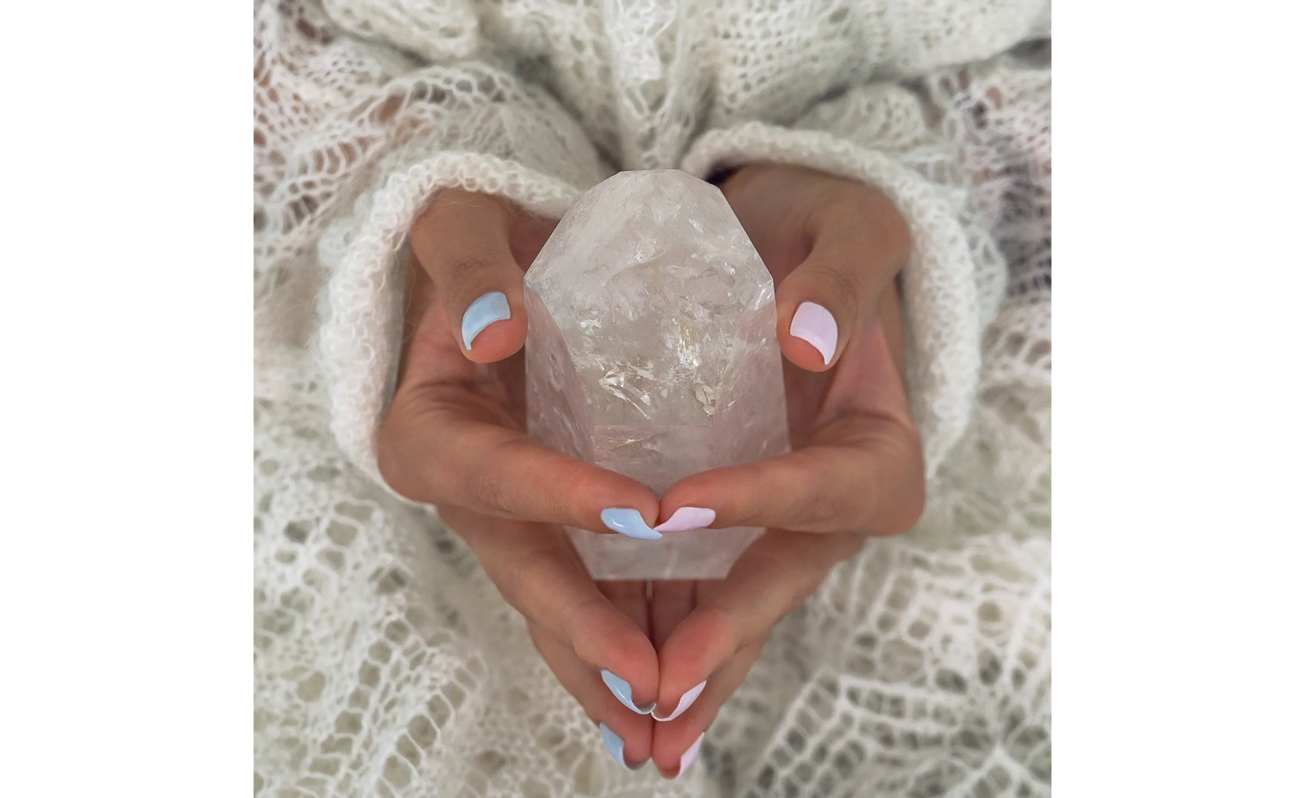 Hands holding a crystal — energy healing